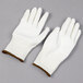 A pair of large Cordova Monarch white engineered fiber work gloves with white polyurethane palm coating.