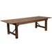 A Flash Furniture Hercules Antique Rustic wooden folding farm table with legs.