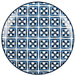 A white porcelain brunch plate with a blue square and a cross in the center.