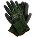 A pair of Cordova Monarch green and black work gloves with a label.