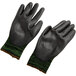 A pair of Cordova Monarch green and black work gloves.