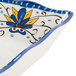 A white melamine tray with a blue and yellow flower design.