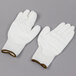 A pair of white Cordova Mirage gloves with white polyurethane palms.