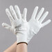 A pair of Cordova Mirage white gloves with a white polyurethane palm coating.