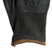 A close up of a pair of black Cordova Monarch work gloves with black polyurethane palms and brown trim.