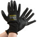 A pair of extra large Cordova Monarch black gloves with black polyurethane palms.