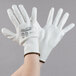 A pair of extra large Cordova white gloves with white polyurethane palms.