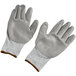 A pair of medium grey Cordova Caliber gloves with gray palm coating.