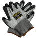 A pair of black and gray Cordova Monarch gloves with a black and yellow label.