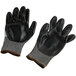 A pair of gray Cordova Monarch work gloves with black HCT nitrile palm coating.