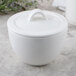 A Villeroy & Boch white porcelain covered sugar bowl on a table.