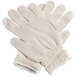 A pair of Cordova white polyester/cotton work gloves with black dots on the palm.