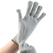 A hand wearing a grey Cordova Monarch engineered fiber glove.
