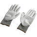 A pair of extra large Cordova gray and white work gloves with gray palms.