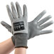 A pair of extra large Cordova Monarch gray work gloves with gray polyurethane palms.