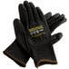 A pair of large black Cordova Monarch work gloves with black polyurethane palms and a yellow logo.