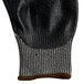 A pair of gray gloves with black and brown palm coating.
