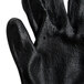 A close up of a pair of gray Cordova Monarch work gloves with black nitrile palms.