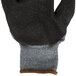 A close up of a black and gray Cordova glove.