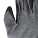 A close up of a pair of Cordova gray gloves with black latex-coated palms.