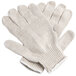 A pair of Cordova white polyester and cotton work gloves with black PVC dots on the palm.