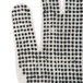 A close-up of a pair of Cordova work gloves with black dots on them.