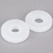 Two white plastic Nemco feeder discs with a nut.