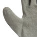 A close up of a Cordova gray and white warehouse glove with crinkle latex on the palm.