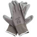 A pair of Cordova gray nylon gloves with gray polyurethane palms.