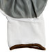A pair of white Cordova warehouse gloves with a brown and white trim.