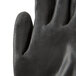 A close-up of a pair of Cordova black polyester gloves with a black polyurethane palm.