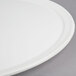 An American Metalcraft white ceramic pizza serving tray with a circular rim.