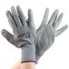 A pair of Cordova gray polyester gloves with gray polyurethane palms.