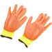 A pair of large yellow gloves with orange palms.