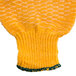 A yellow knitted fabric with green trim.