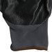 A close up of a gray Cordova warehouse glove with black nitrile coating.