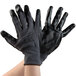 A pair of gray Cordova work gloves with black nitrile palm coating.