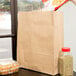 Duro Super Royal Natural Kraft Paper Shopping Bag with Handles 14" x 10" x 15 3/4"   - 200/Bundle Main Thumbnail 1