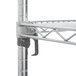 A Metro chrome wire shelving unit with metal poles.