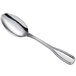 An Acopa Scottdale stainless steel tablespoon with a long silver handle and a silver spoon.