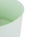 A green plastic base for a white Choice round beverage dispenser.