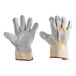 A pair of Cordova white canvas work gloves with side split leather palm coating and rubber cuffs on a white background.