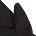 A close up of a brown Cordova jersey glove with a thumb.