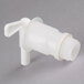 A white plastic Impact vented dispensing container faucet.