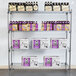 A Metro wire shelving unit with beer bottles and boxes on the shelves.