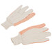 A pair of white Cordova work gloves with orange dots on the palm.