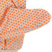 A Cordova warehouse glove with an orange PVC dotted palm.