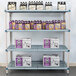 MetroMax Q shelving unit with boxes and bottles of beer on the shelves.