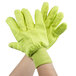 A pair of green and yellow Cordova work gloves.