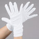 A pair of Cordova white stretch nylon inspector's gloves.